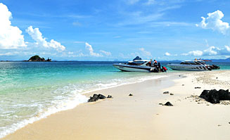 Family enjoying Khai Nok Island beach during Khai Islands Tour
